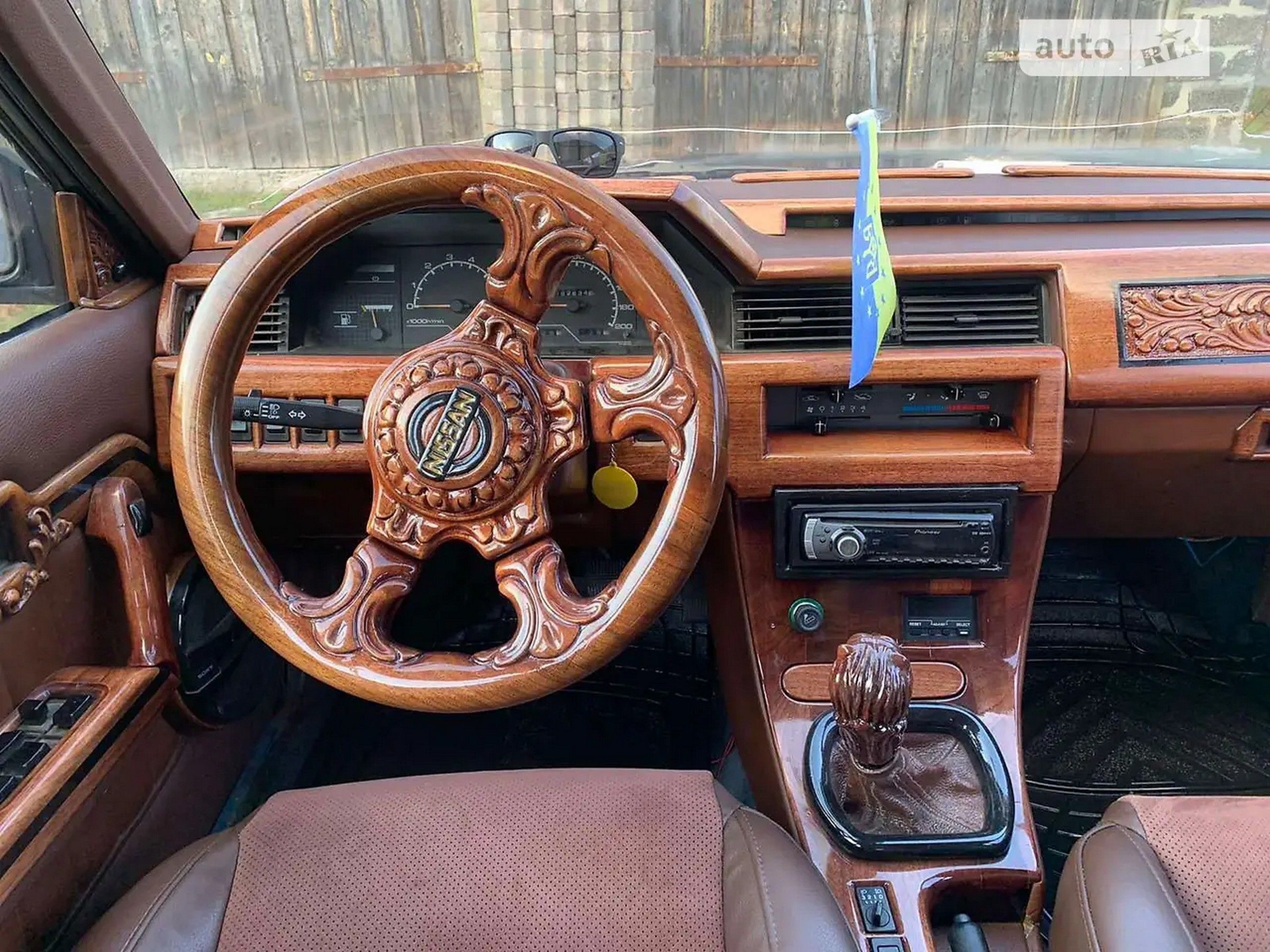 In Cherkasy sell a unique Nissan Bluebird with a wooden interior